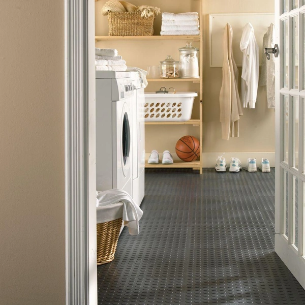 Charcoal coin-pattern rubber flooring in a laundry