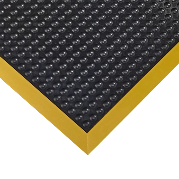 Close-up of black bubble mat with yellow safety border