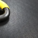 Detail of non-slip texture on black rubber flooring