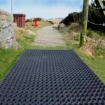 Large rubber mat on an outdoor grass path