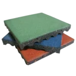 Stacked green, blue, and red rubber playground tiles