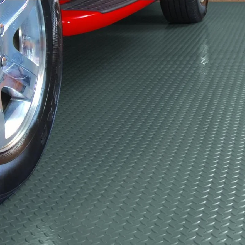 Textured black rubber tiles with a raised coin-top pattern