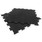 Two black interlocking tiles showing grid-textured back